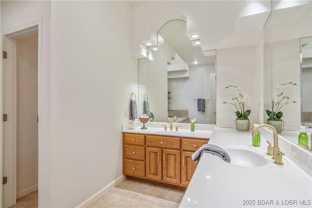 bathroom featuring tile patterned flooring, recessed lighting, vanity, and baseboards