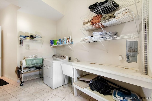 laundry area with laundry area and light tile patterned floors