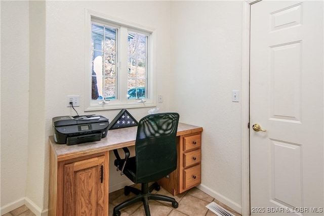 home office featuring light tile patterned flooring, visible vents, and baseboards