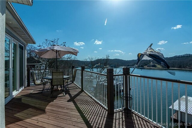 balcony featuring a water view