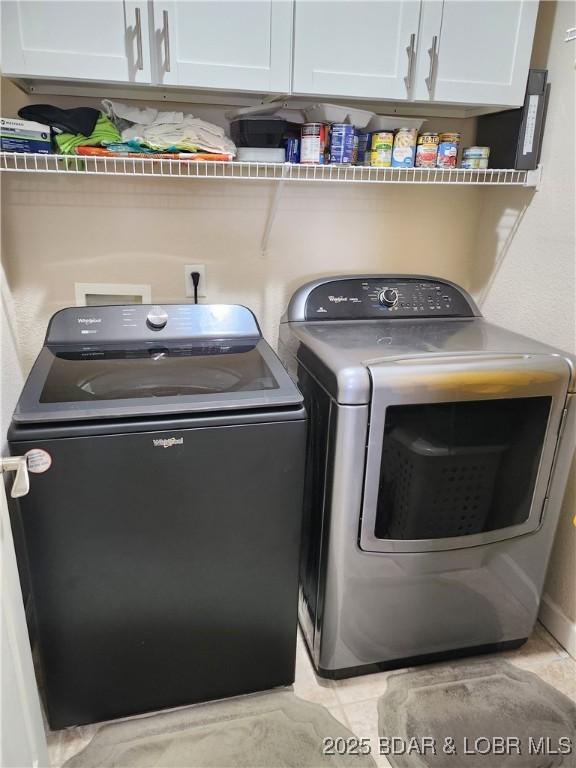 201 Marina Residence Dr Unit 3C, Camdenton, MO 65020 - laundry room featuring independent washer and dryer and cabinet space