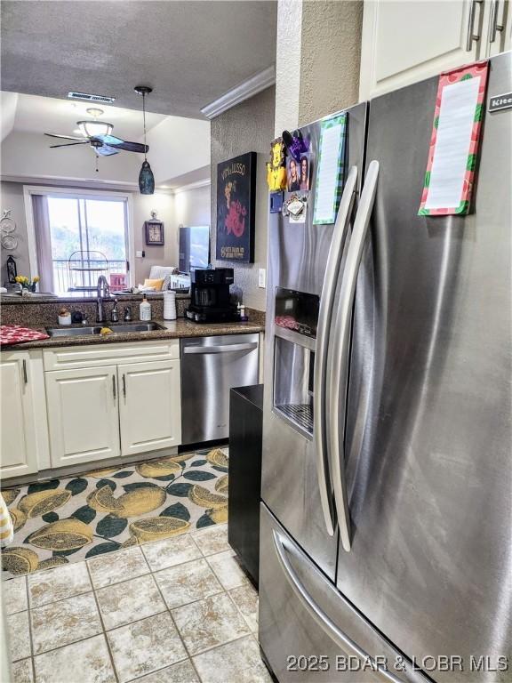 201 Marina Residence Dr Unit 3C, Camdenton, MO 65020 - kitchen featuring appliances with stainless steel finishes, a sink, white cabinets, a ceiling fan, and lofted ceiling