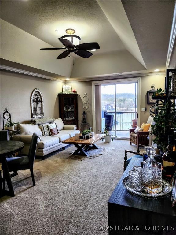 201 Marina Residence Dr Unit 3C, Camdenton, MO 65020 - carpeted living room featuring ceiling fan and lofted ceiling