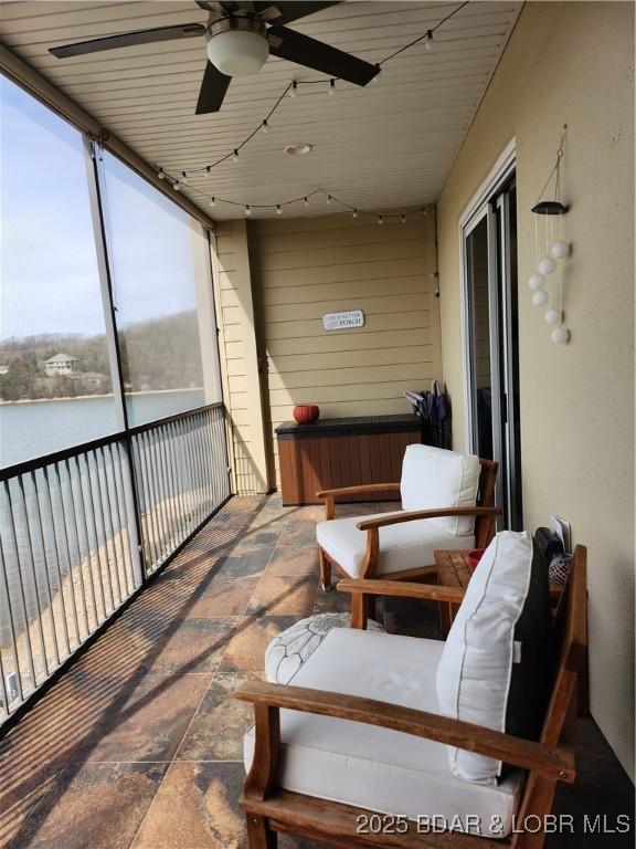201 Marina Residence Dr Unit 3C, Camdenton, MO 65020 - sunroom / solarium with ceiling fan and a water view