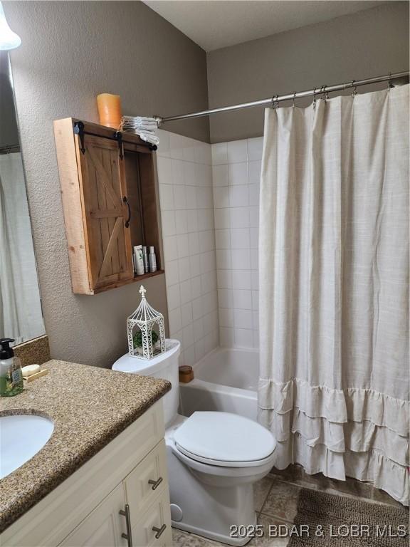 201 Marina Residence Dr Unit 3C, Camdenton, MO 65020 - full bathroom with vanity, toilet, shower / bath combo with shower curtain, and a textured wall