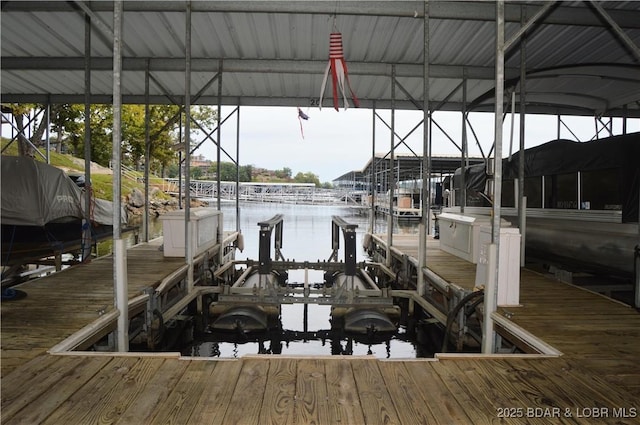 207 Circle Edge Unit 1A, Lake Ozark, MO 65049 - dock featuring boat lift and a water view