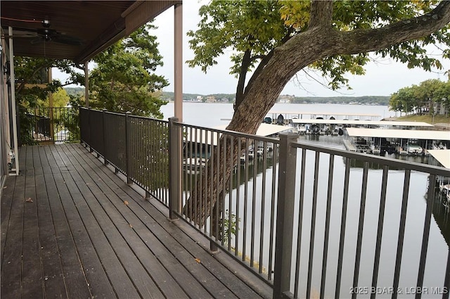 207 Circle Edge Unit 1A, Lake Ozark, MO 65049 - wooden terrace with a water view and ceiling fan