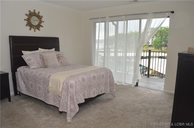 207 Circle Edge Unit 1A, Lake Ozark, MO 65049 - carpeted bedroom featuring access to exterior, multiple windows, and ornamental molding