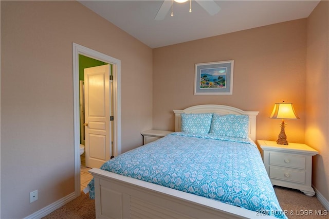 bedroom featuring baseboards, light colored carpet, and ceiling fan