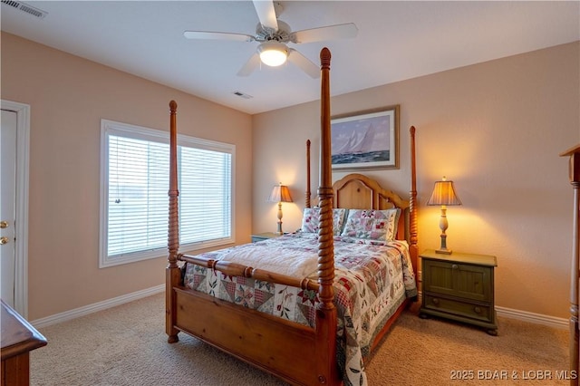 bedroom with visible vents, baseboards, light colored carpet, and a ceiling fan