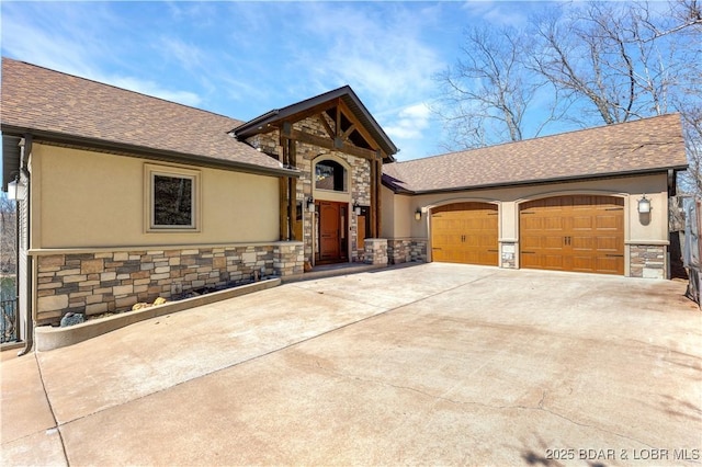 view of front of property with stone siding, driveway, a garage, stucco siding, and a shingled roof