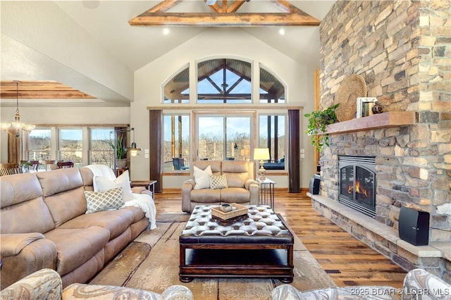 189 Black Rock Rd, Camdenton, MO 65020 - living room with a chandelier, a fireplace, light wood-type flooring, and high vaulted ceiling