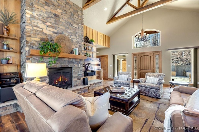 189 Black Rock Rd, Camdenton, MO 65020 - living area featuring beamed ceiling, high vaulted ceiling, wood finished floors, and a stone fireplace