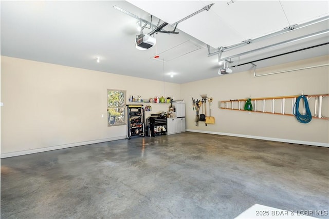 garage with a garage door opener and baseboards