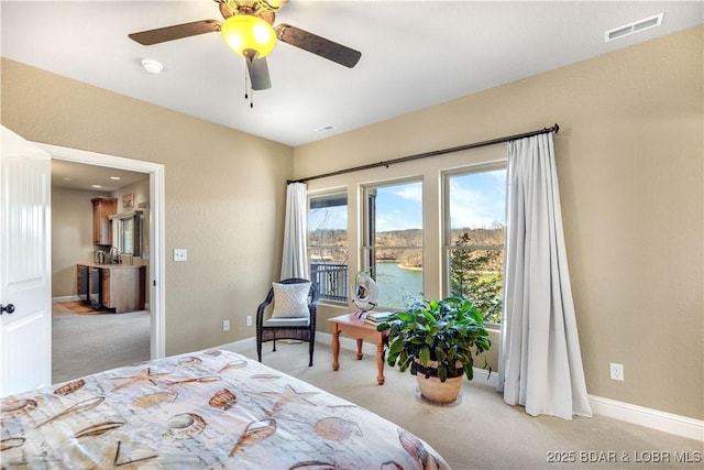 carpeted bedroom with baseboards and a ceiling fan