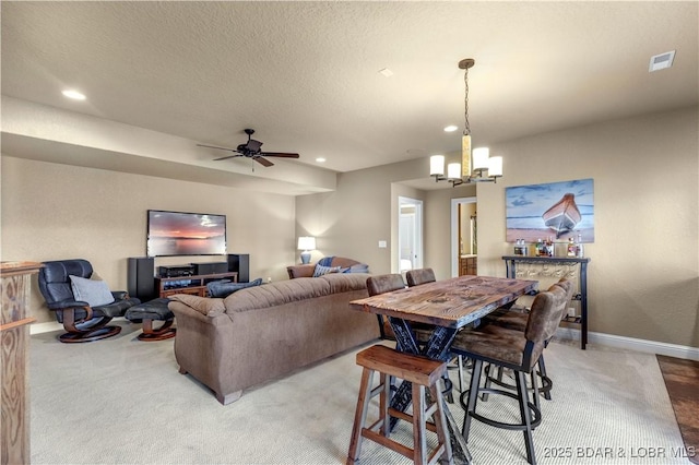 dining space with light colored carpet, recessed lighting, a chandelier, baseboards, and a ceiling fan