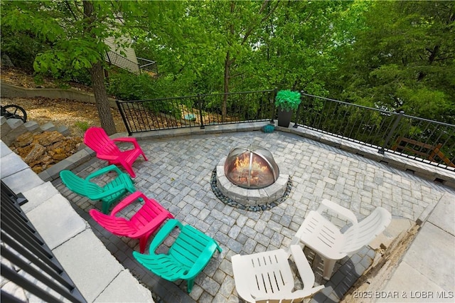 view of patio / terrace with an outdoor fire pit