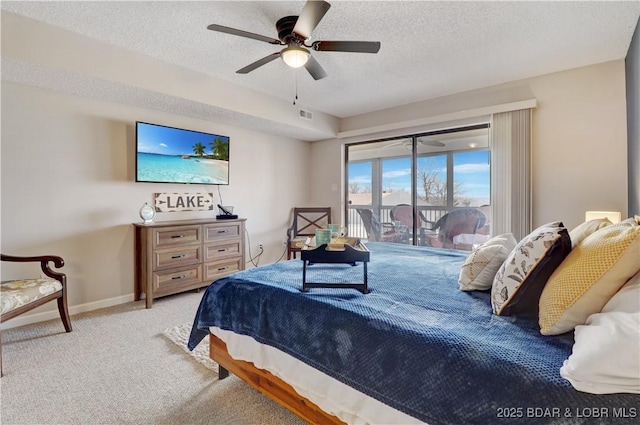 bedroom with visible vents, carpet, a textured ceiling, and access to exterior