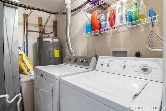 washroom featuring electric water heater, laundry area, and washing machine and clothes dryer