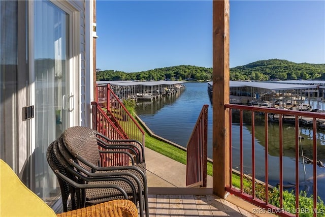686 Clearwater Dr Unit 1E, Camdenton, MO 65020 - balcony featuring a water view and a wooded view