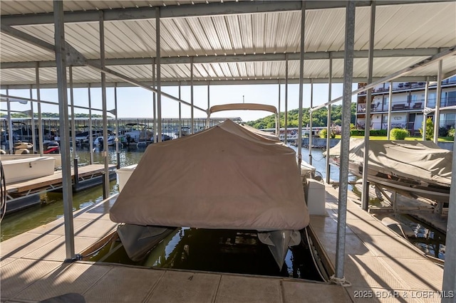 686 Clearwater Dr Unit 1E, Camdenton, MO 65020 - dock with boat lift and a water view