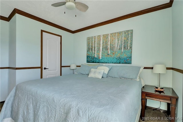 carpeted bedroom featuring ceiling fan and ornamental molding