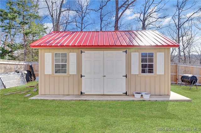 view of shed with a fenced backyard