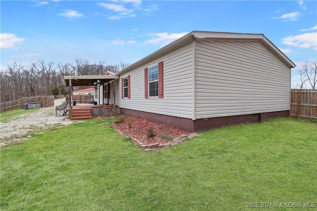 view of side of property featuring a fenced backyard, a wooden deck, a yard, and crawl space