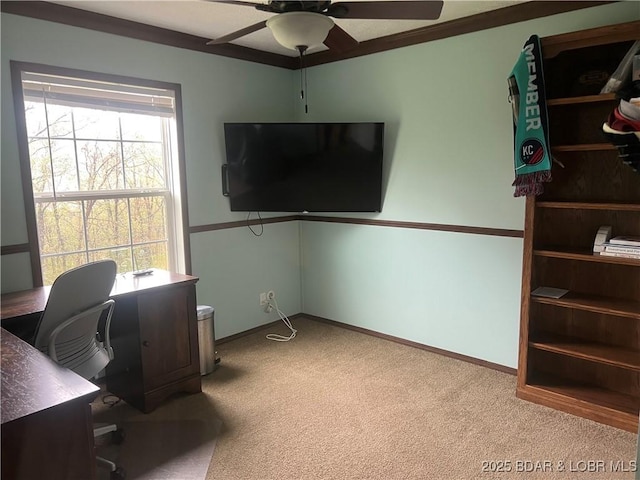 carpeted office with baseboards and ceiling fan