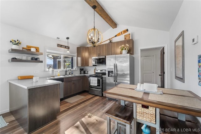 27570 Golden Point Ln, Barnett, MO 65011 - kitchen featuring appliances with stainless steel finishes, a chandelier, dark wood finished floors, and hanging light fixtures