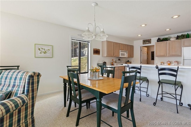 262 Bluff Blvd Unit 1B, Camdenton, MO 65020 - dining room with light carpet, baseboards, recessed lighting, and a chandelier