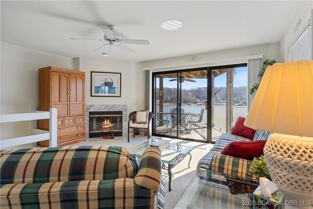 262 Bluff Blvd Unit 1B, Camdenton, MO 65020 - carpeted bedroom with a high end fireplace, ceiling fan, and access to outside