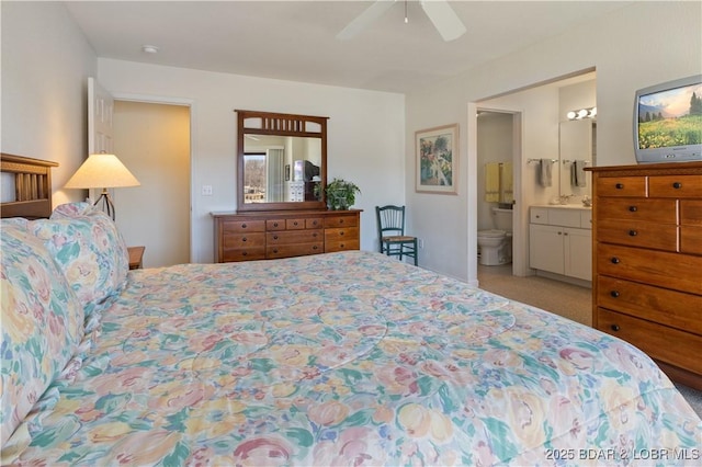 262 Bluff Blvd Unit 1B, Camdenton, MO 65020 - bedroom with carpet flooring, a sink, ensuite bathroom, and ceiling fan
