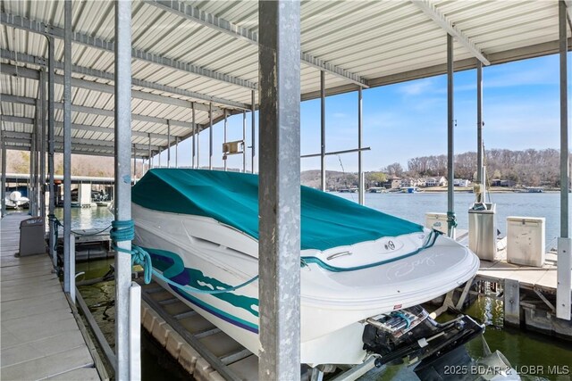 262 Bluff Blvd Unit 1B, Camdenton, MO 65020 - dock area with boat lift and a water view