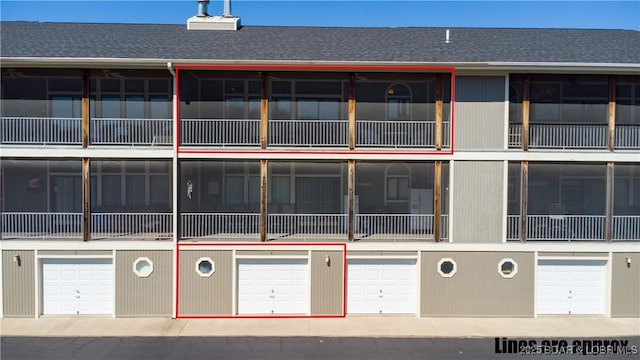 611 Lazy Days Rd Unit L6, Osage Beach, MO 65065 - view of building exterior with an attached garage