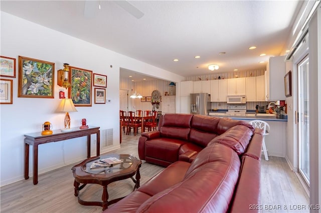 611 Lazy Days Rd Unit L6, Osage Beach, MO 65065 - living area featuring light wood-style floors, recessed lighting, a ceiling fan, and baseboards