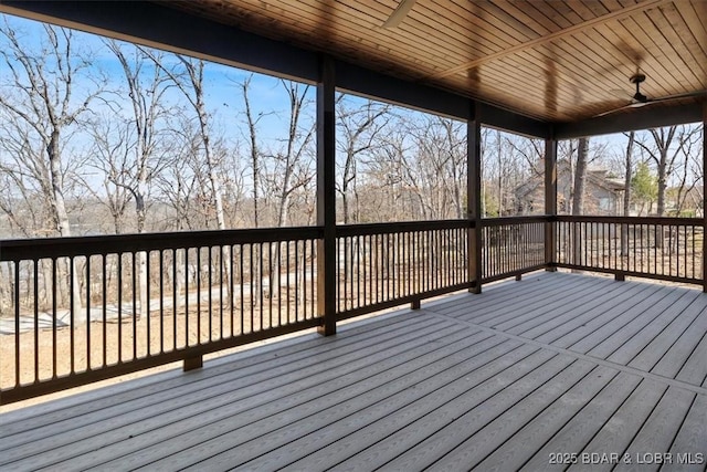 wooden terrace featuring a ceiling fan