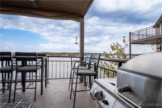 4465 Hamrock Ln Unit 502, Osage Beach, MO 65065 - balcony with a water view and a grill