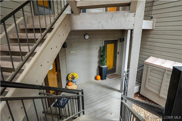 4465 Hamrock Ln Unit 502, Osage Beach, MO 65065 - stairs featuring a towering ceiling, wood finished floors, and wooden walls