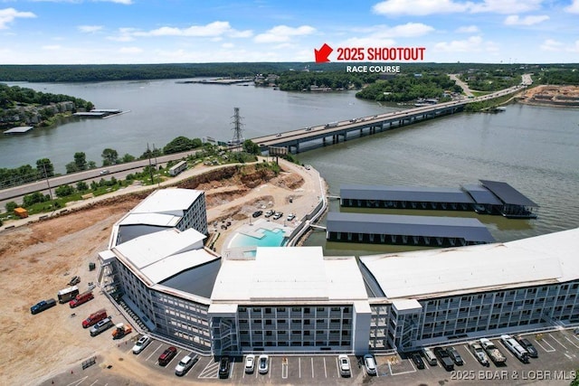 1045 Topsider Ln Unit 113, Osage Beach, MO 65065 - bird's eye view of a nearby body of water, apartment complex, a notable bridge, and a pool