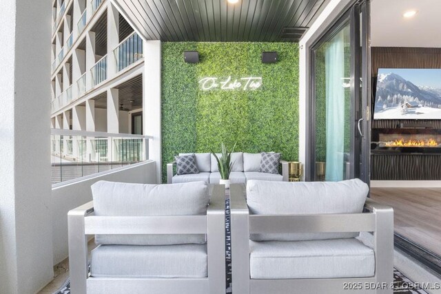 1045 Topsider Ln Unit 113, Osage Beach, MO 65065 - view of patio featuring an outdoor living space and a balcony