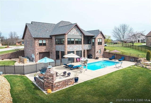 view of pool with a fenced backyard, a lawn, a patio, and a fenced in pool