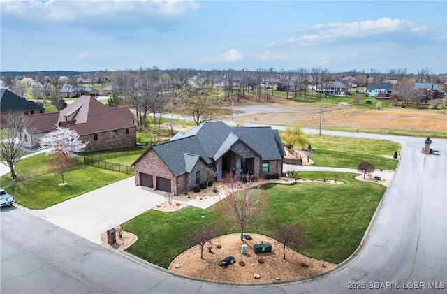 birds eye view of property with a residential view