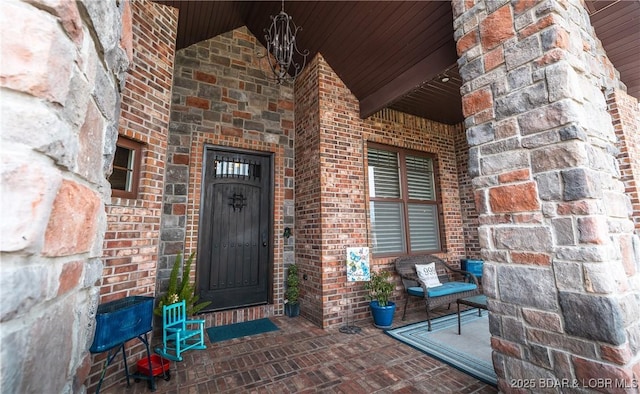 doorway to property with brick siding