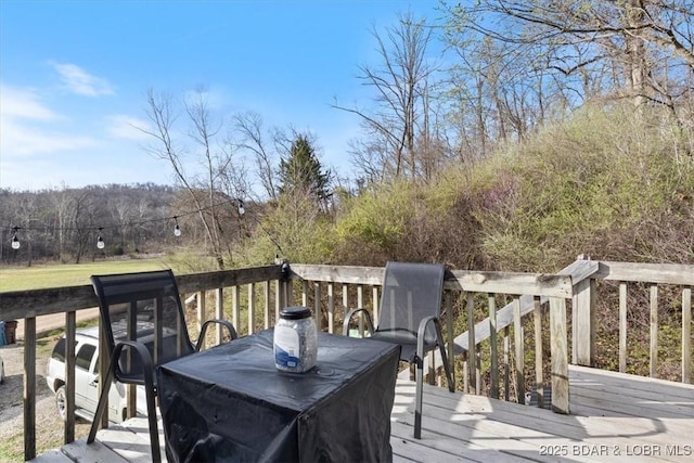 145 Oak Bnd, Kaiser, MO 65047 - wooden terrace featuring outdoor dining space