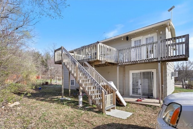 145 Oak Bnd, Kaiser, MO 65047 - rear view of property with a wooden deck and stairs