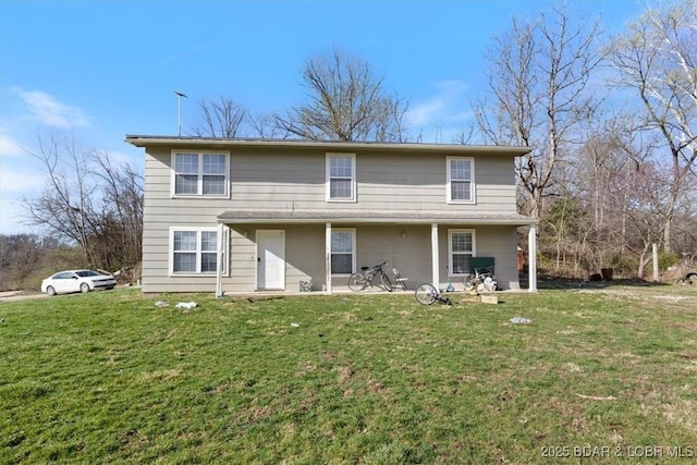145 Oak Bnd, Kaiser, MO 65047 - back of house with a lawn and a patio area