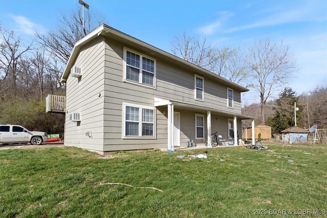 145 Oak Bnd, Kaiser, MO 65047 - rear view of house with a lawn