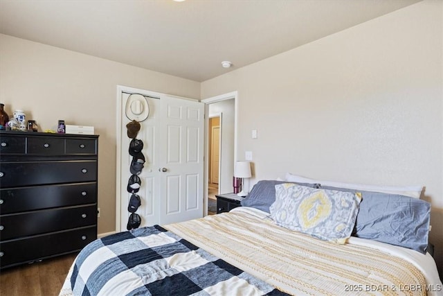 145 Oak Bnd, Kaiser, MO 65047 - bedroom with dark wood finished floors and a closet