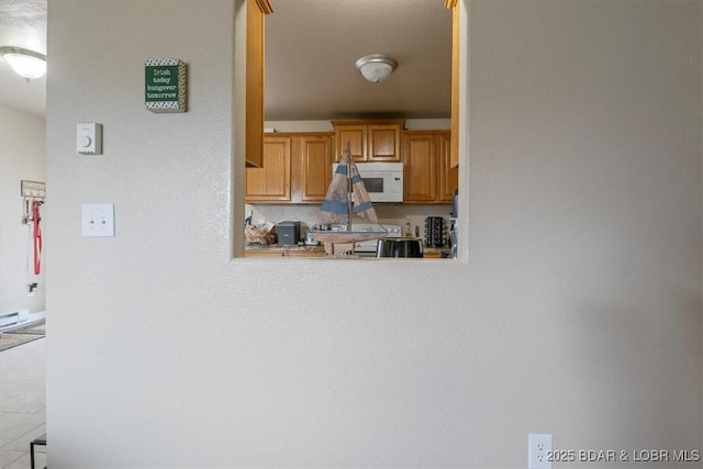 145 Oak Bnd, Kaiser, MO 65047 - kitchen with white microwave and light countertops